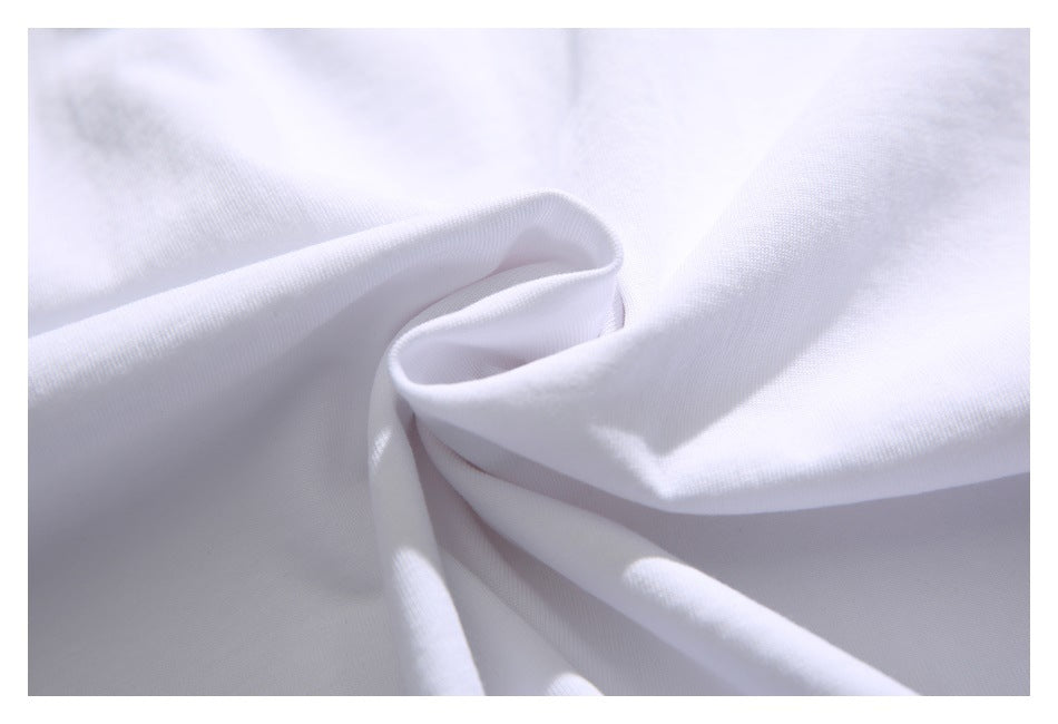 Close-up of smooth white fabric gathered into soft folds.