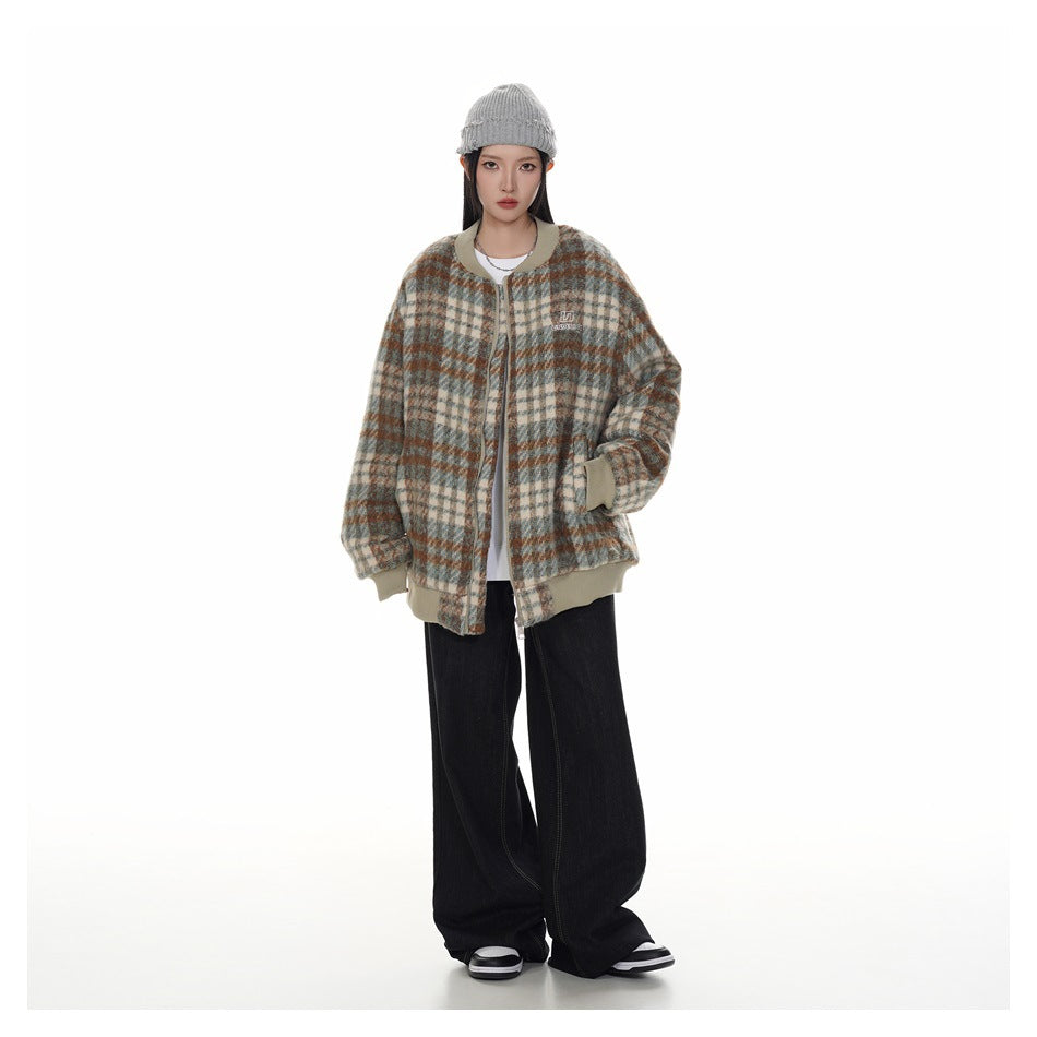 Full-length front view of a model wearing a plaid zip jacket with beige trim, black wide-leg pants, and a gray beanie.