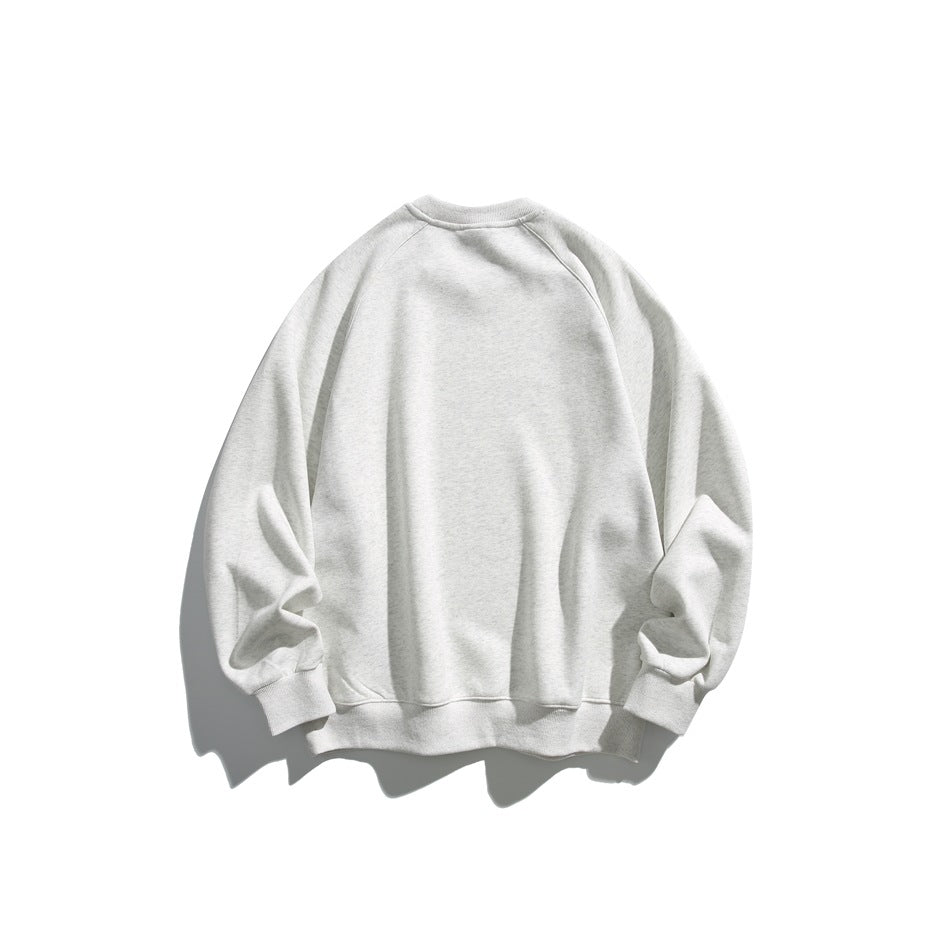 Back view of a light gray raglan crewneck sweatshirt with ribbed cuffs and hem.