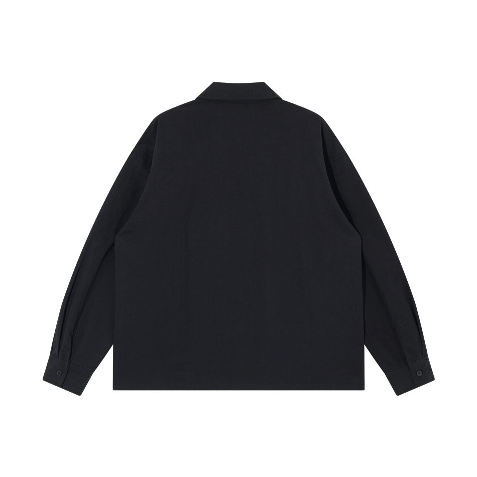 Back view of a plain black long-sleeve shirt with a collar and button cuffs, flat lay