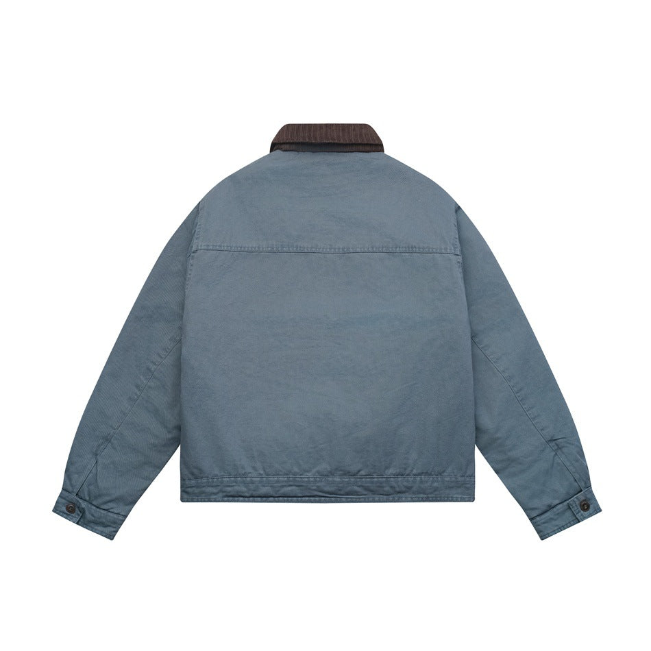 Back view of a faded blue jacket with a brown ribbed collar and buttoned cuffs.