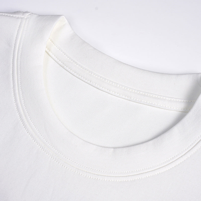 Close-up of a white T-shirt's ribbed crew neckline and double-stitched collar.