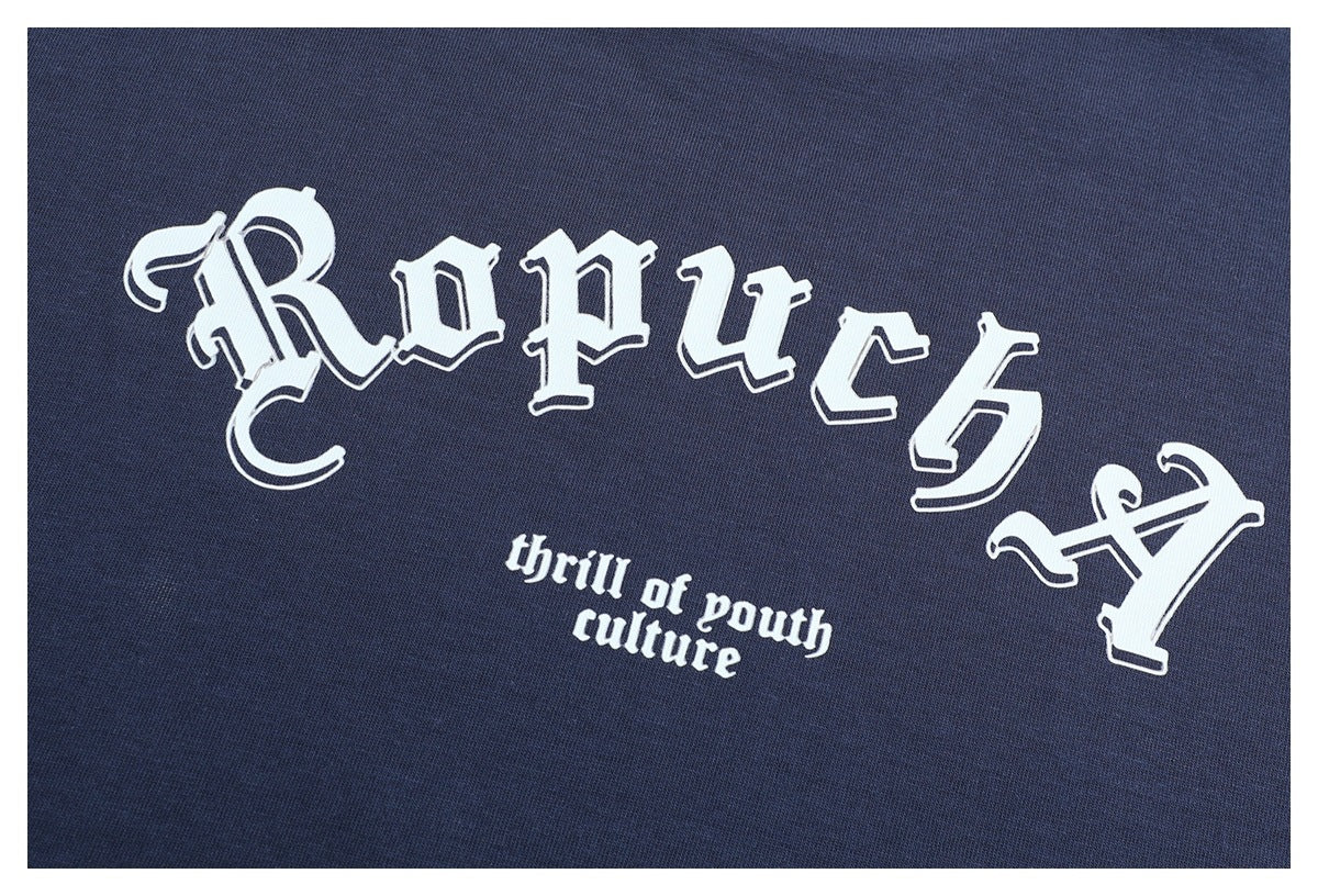White ornate lettering and the phrase “thrill of youth culture” printed on dark navy fabric.