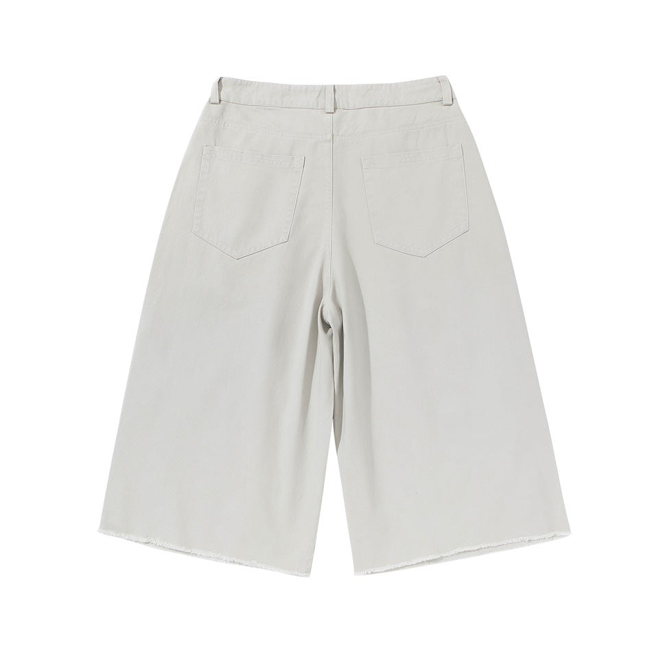 Light gray-white wide-leg knee-length shorts, back view, with two patch pockets and frayed hem