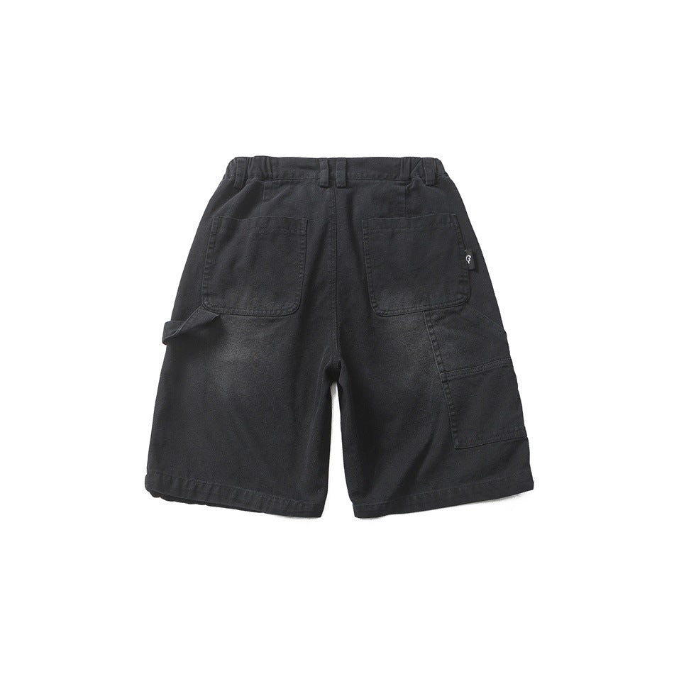 Back flat lay of black washed carpenter shorts with two patch pockets and side utility pocket