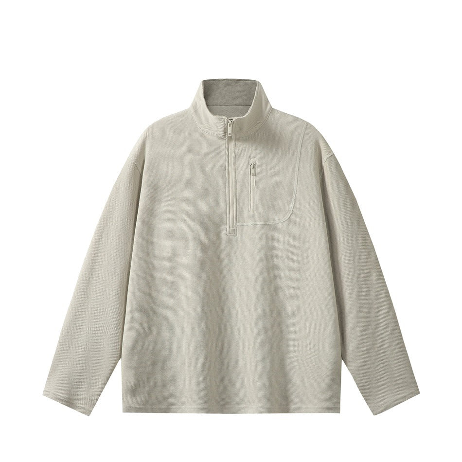 Light gray half-zip waffle-knit pullover with stand collar and zippered chest pocket, flat front view