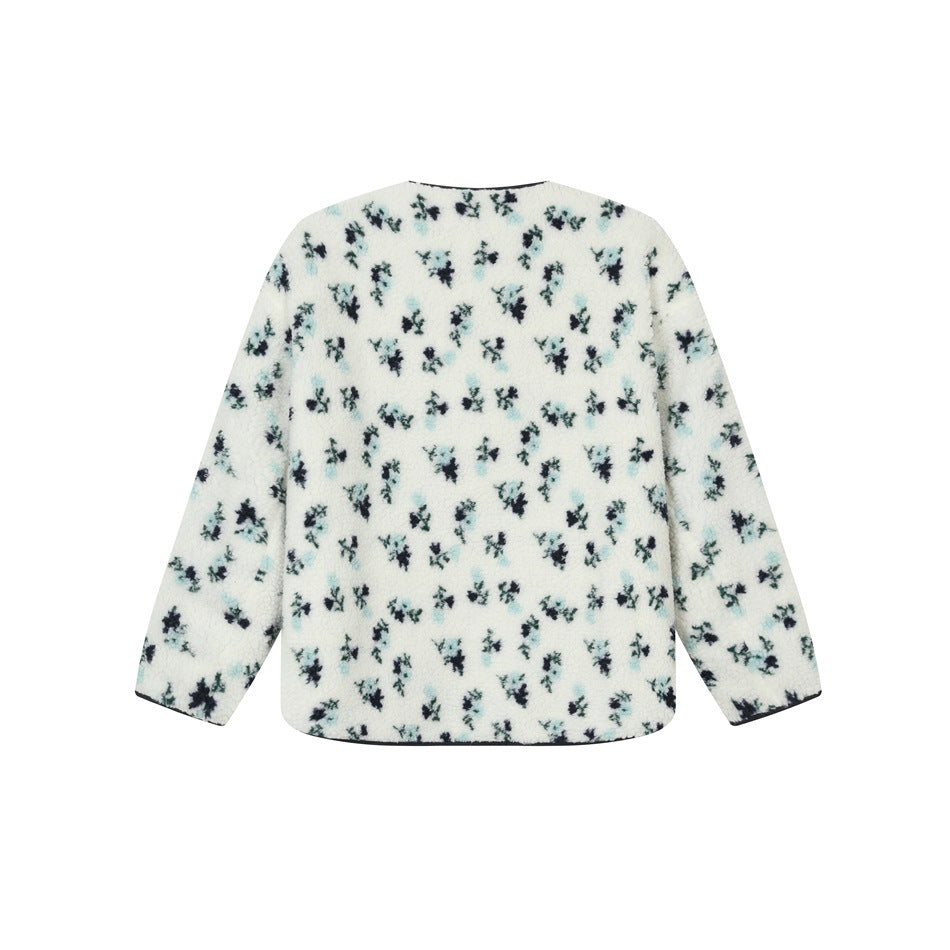 Back view of a cream sherpa jacket with scattered teal and navy floral print and long sleeves.