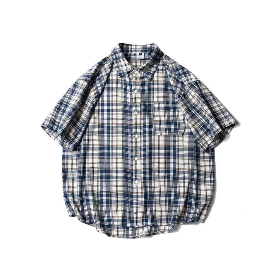 Navy, cream and white plaid short-sleeve button-up shirt with chest pocket, laid flat, front view