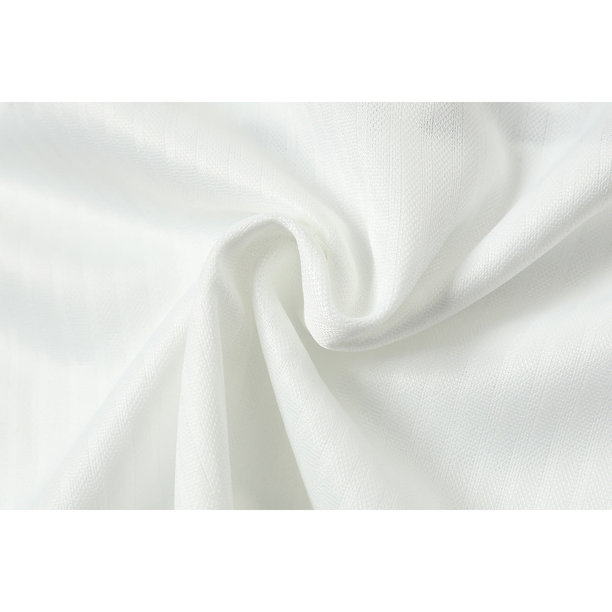 Close-up of white jersey fabric draped to show its fine textured surface.