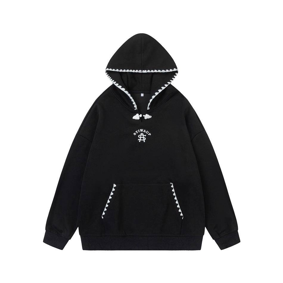 Black pullover hoodie with white scalloped trim on hood and pocket, knot closure at neckline, front view