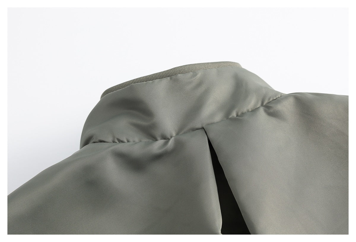 Close-up of the olive-gray jacket collar and shoulder construction.