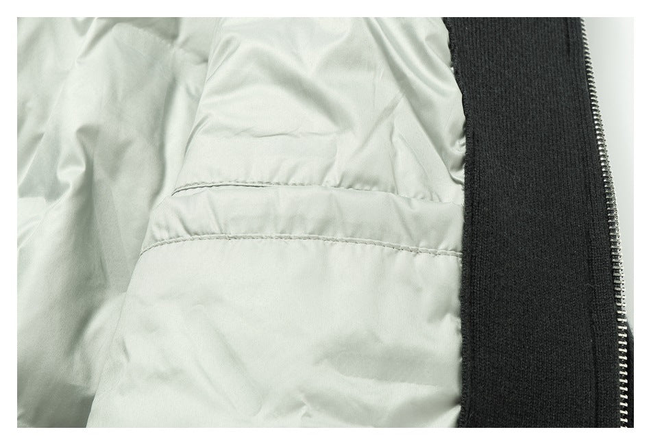 Interior close-up of pale lining, a dark ribbed edge, and a metal zipper.