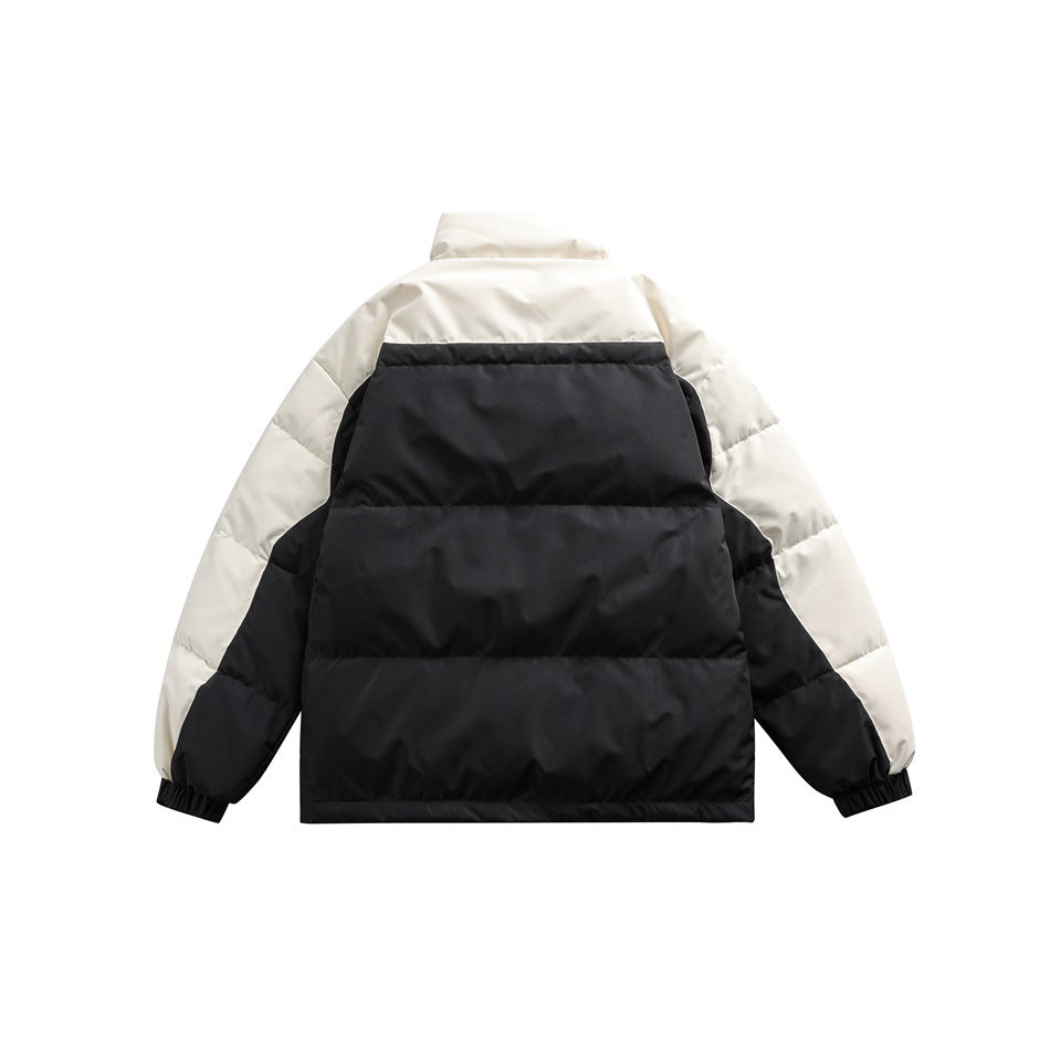 Back view of black and cream quilted puffer jacket with stand collar and elastic cuffs