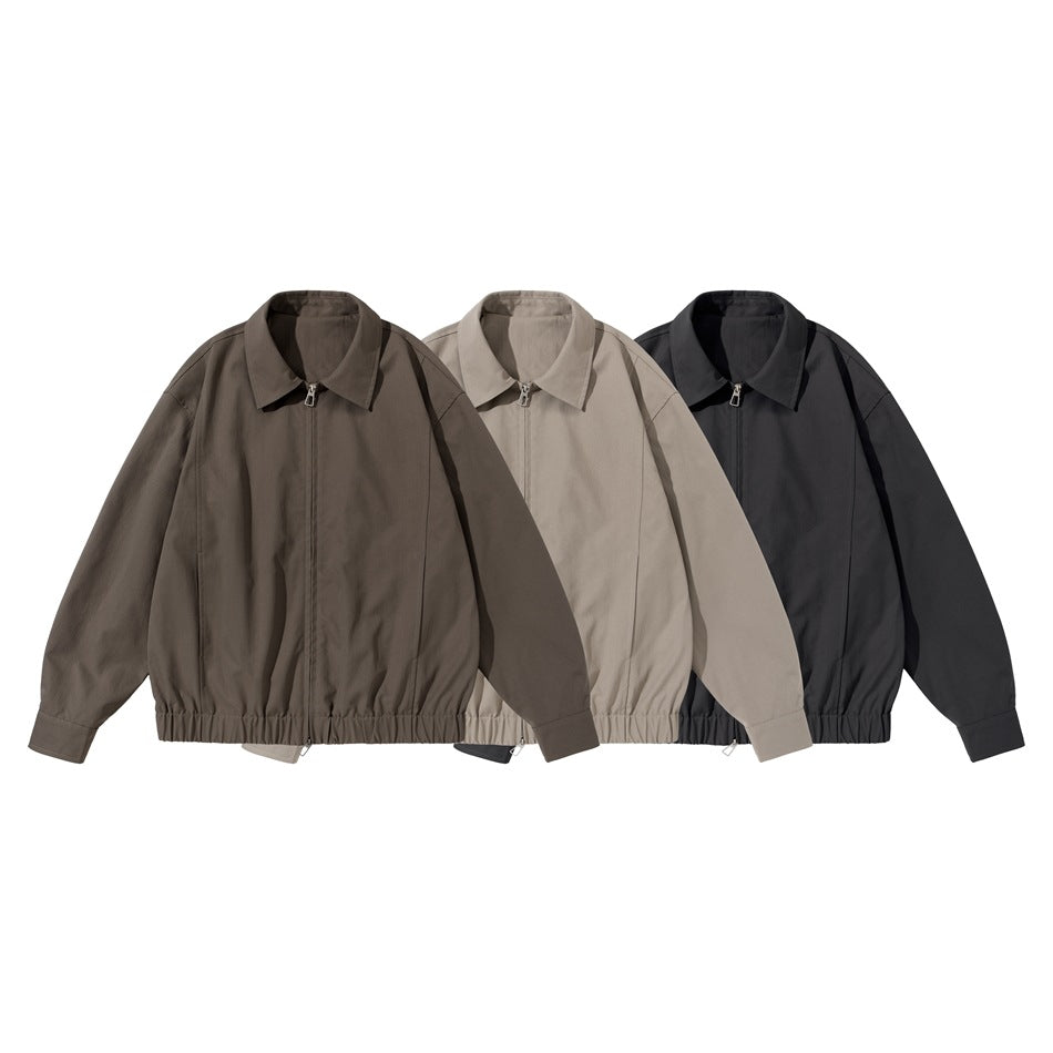 Three zip-front jackets with pointed collars and gathered hems in brown, taupe, and black.