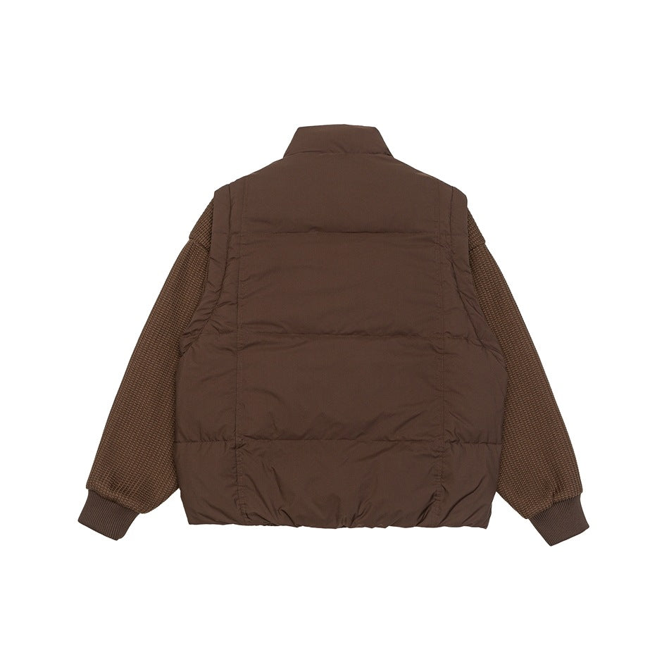 Back view of a brown jacket with a padded body, textured knit sleeves, high collar and ribbed cuffs.