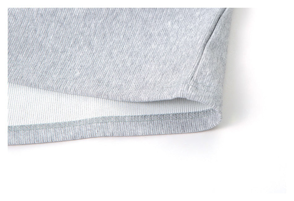 Close-up of the heather gray shirt hem with visible stitching and the inner fabric.