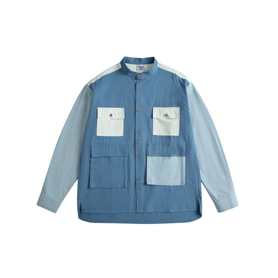 Blue color-block stand-collar button shirt with cream flap chest pockets and patch pockets, flat front view