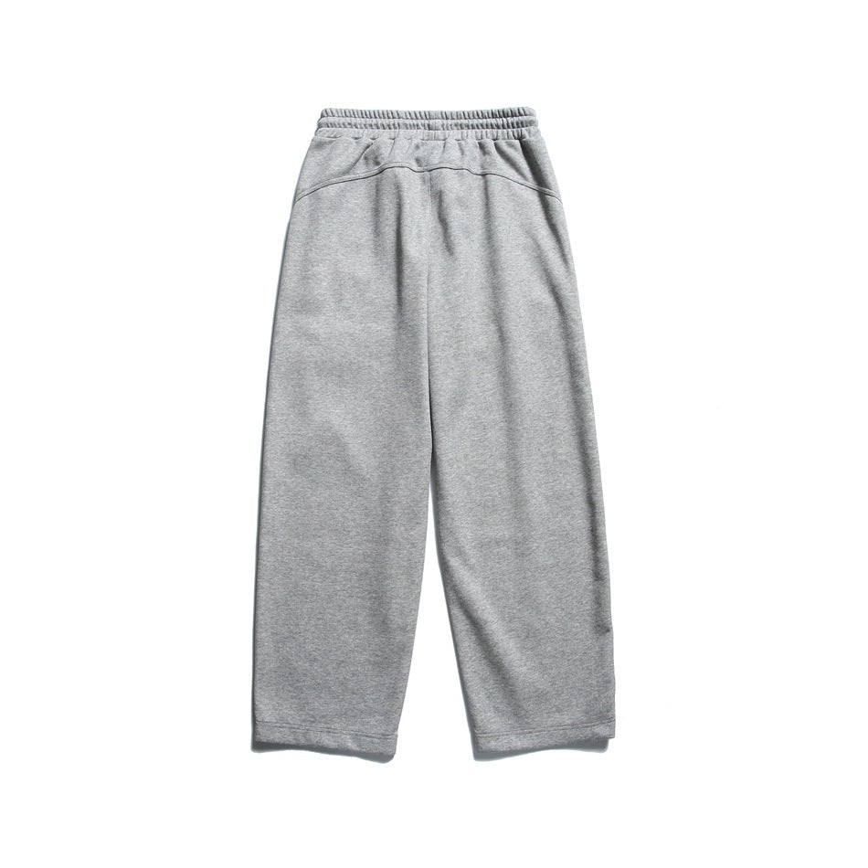 Light heather gray wide-leg sweatpants shown from the back with an elastic waistband and curved yoke seam.