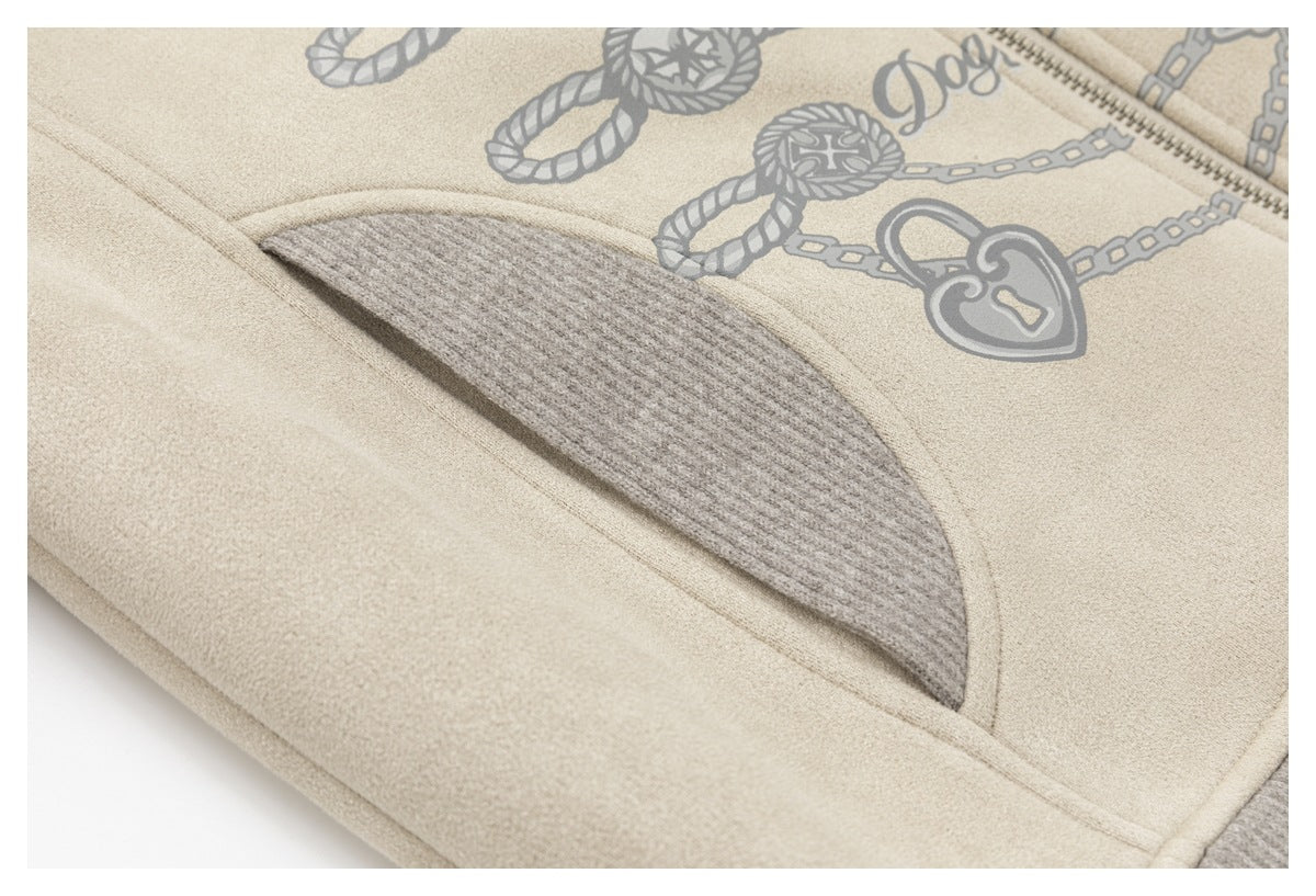Close-up of a curved pocket with a gray ribbed panel, beside the jacket's printed rope-and-chain artwork.