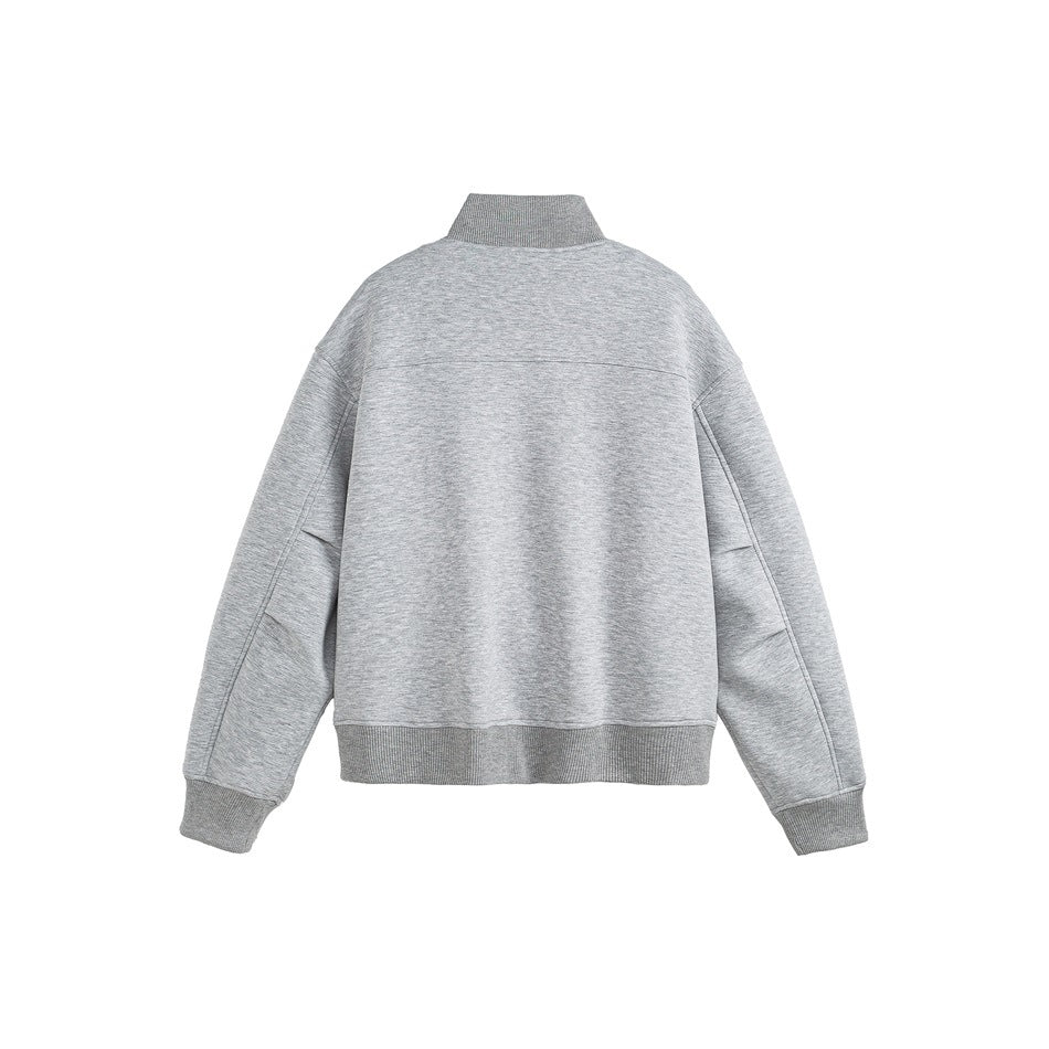 Back view of a light gray jacket with a stand collar, long sleeves, and ribbed cuffs and hem on a white background.