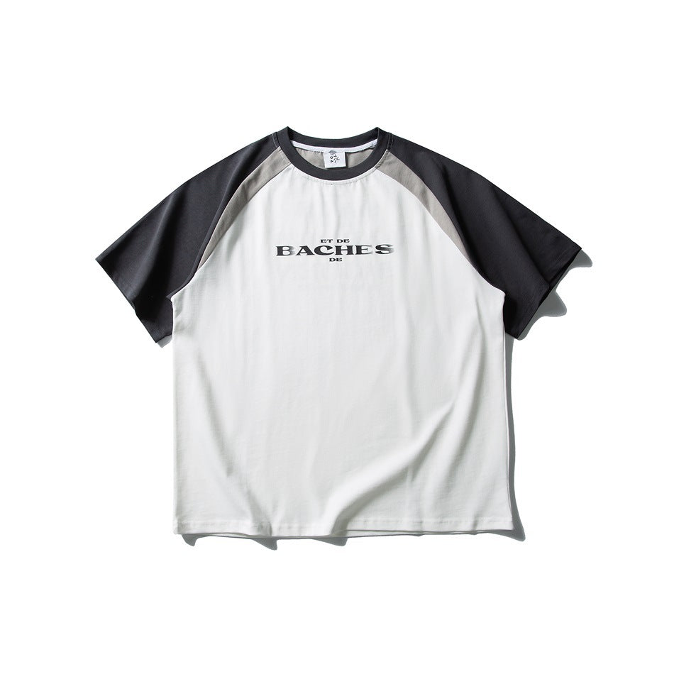 Front view of a white raglan T-shirt with charcoal sleeves, gray shoulder panels, and small black chest lettering.