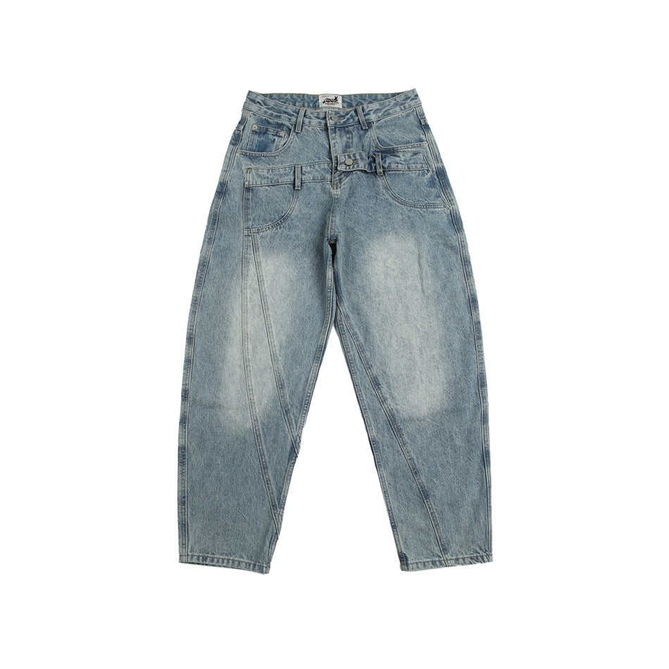 Front flat lay of light blue washed jeans with layered double waistband, diagonal leg seams and faded thighs