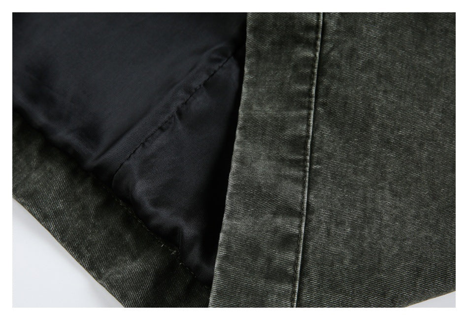 Close-up showing the dark jacket's black lining and turned-back outer fabric.