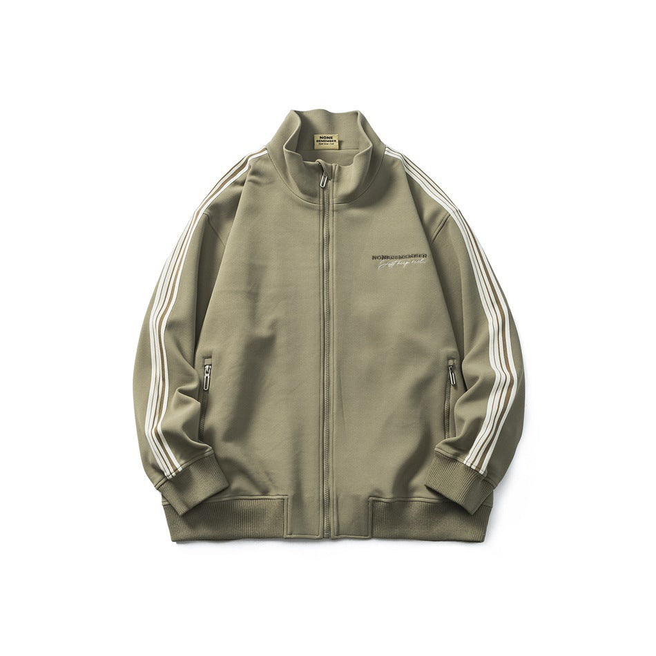 Olive-khaki stand-collar zip jacket with striped sleeves, ribbed cuffs and hem, and zippered pockets, flat lay front view