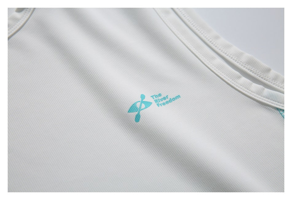 White textured garment with a small turquoise logo and the words “The New Freedom.”
