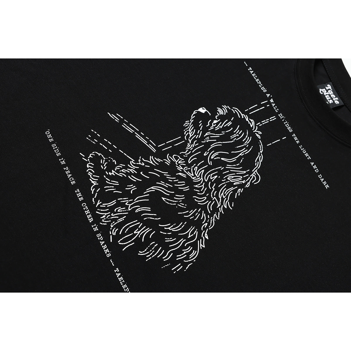 Close-up of a white line-art dog illustration and English text printed on a black T-shirt.