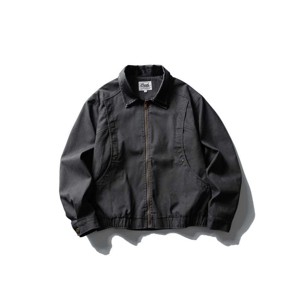 Dark gray zip-front collared jacket with curved seams, side rivet pockets and elastic hem, flat lay