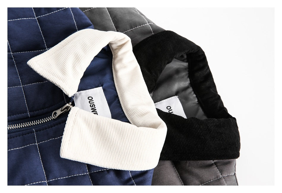 Close-up of navy and gray quilted jackets showing contrasting collars, zippers, and interior labels.
