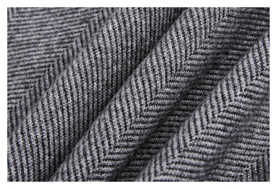 Macro view of gray and black herringbone fabric folds.