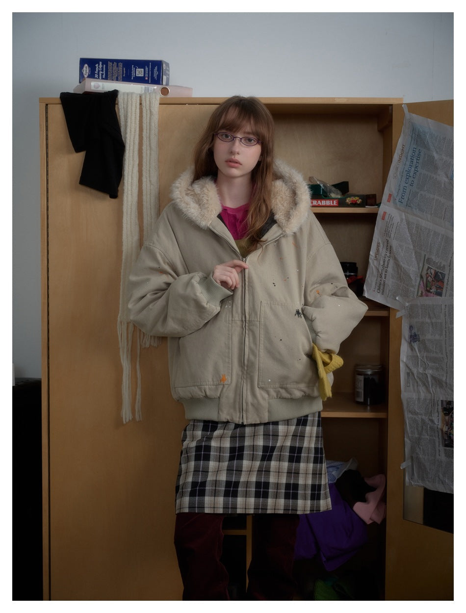 Model wearing a beige oversized zip jacket with a cream faux-fur collar, shown from the front.