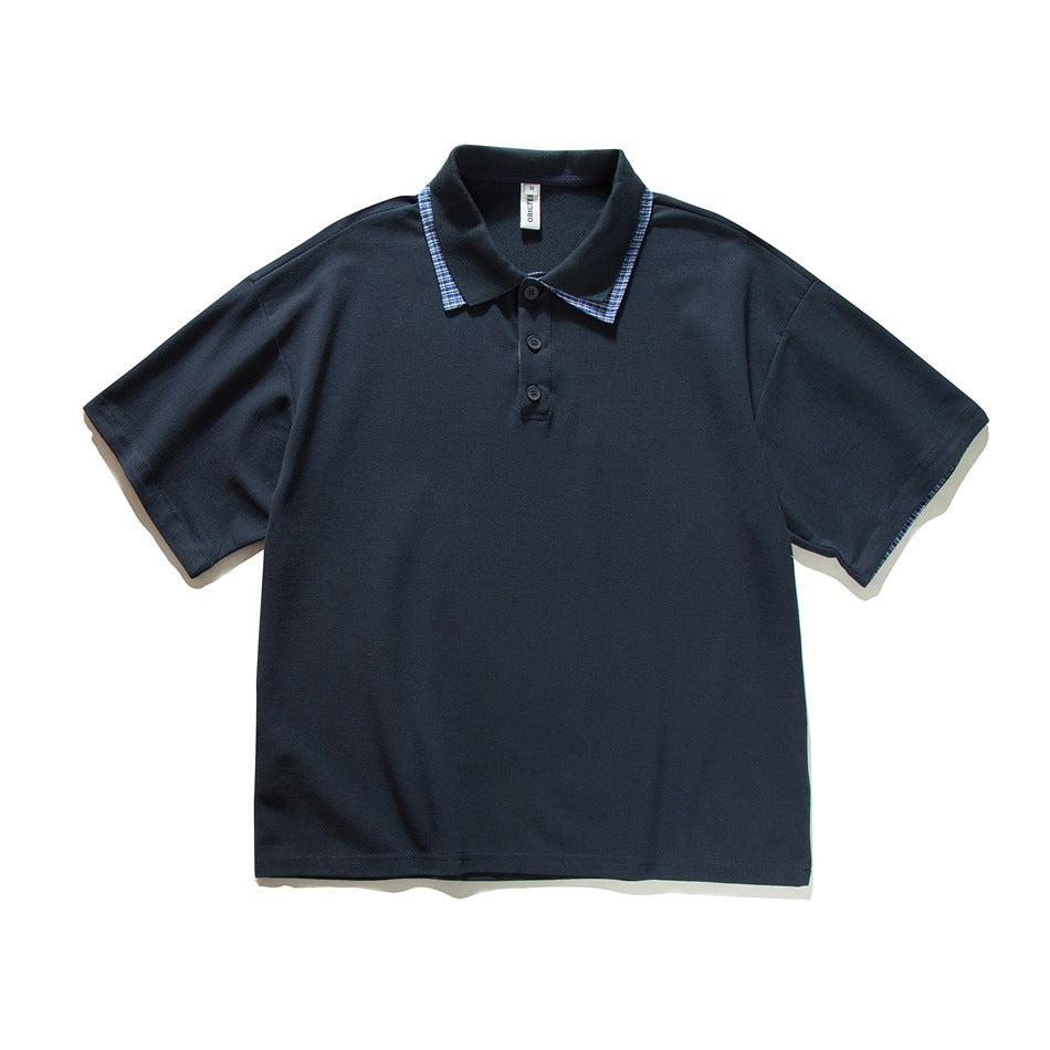 Navy blue short-sleeve polo shirt, flat front view with blue plaid undercollar and three-button placket