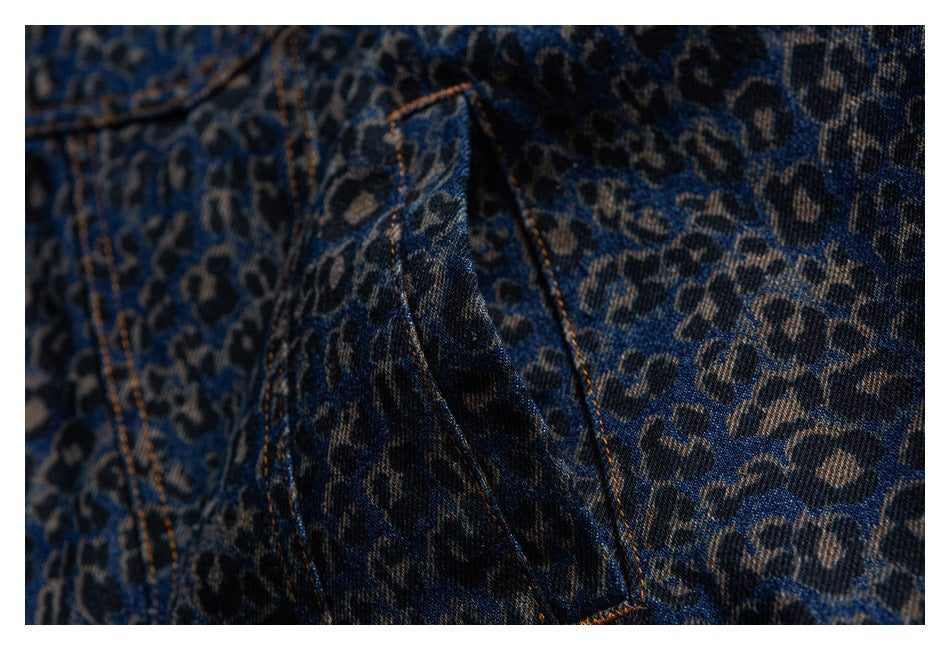 Close-up of the jacket's leopard-patterned denim pocket opening and contrast-stitched seams.