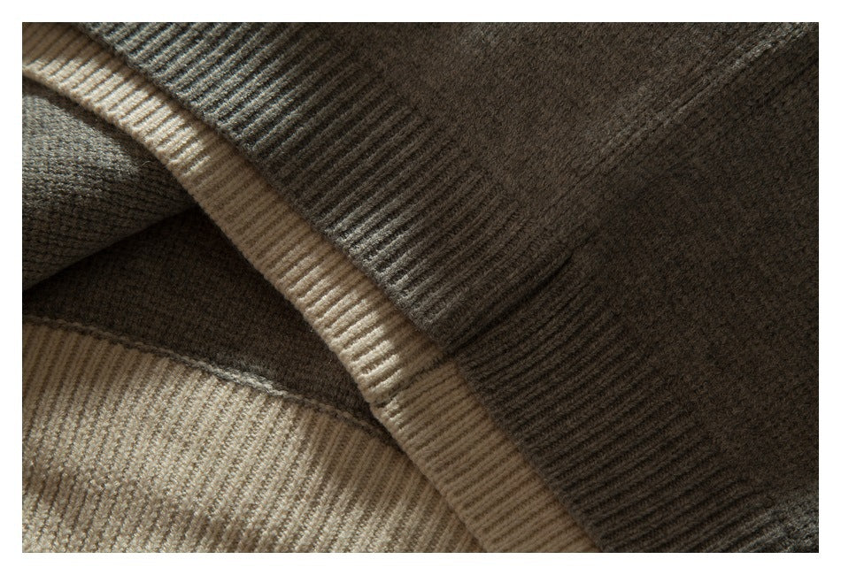 Close-up of taupe-gray knit fabric with a curved beige ribbed edge and folded ribbed trim.