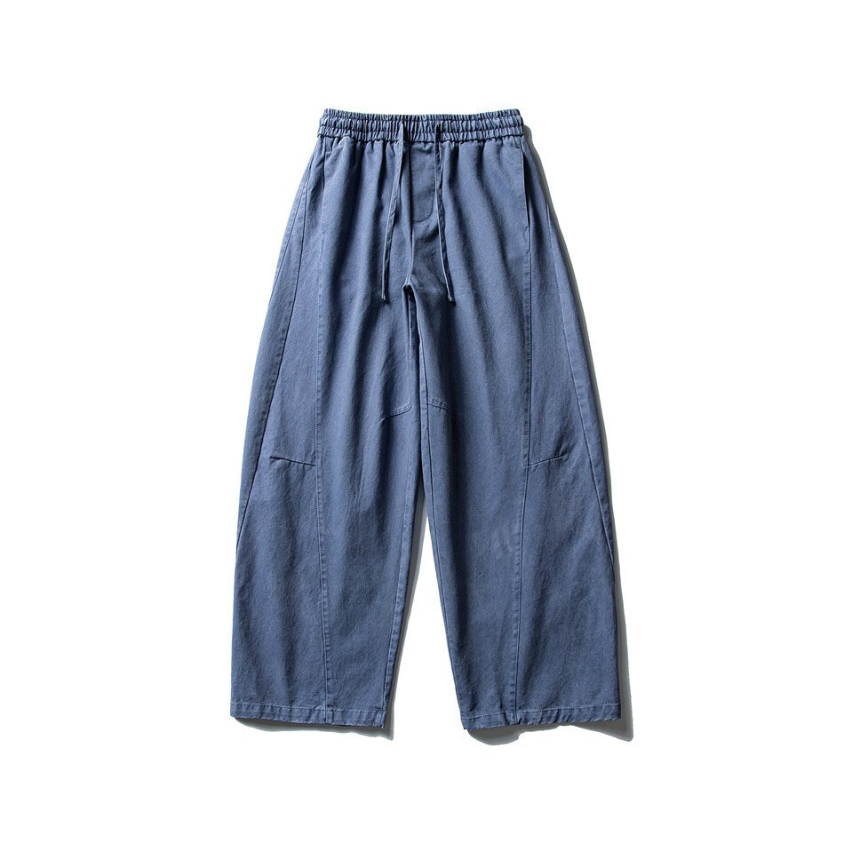 Blue wide-leg pants with an elastic drawstring waistband, flat lay front view