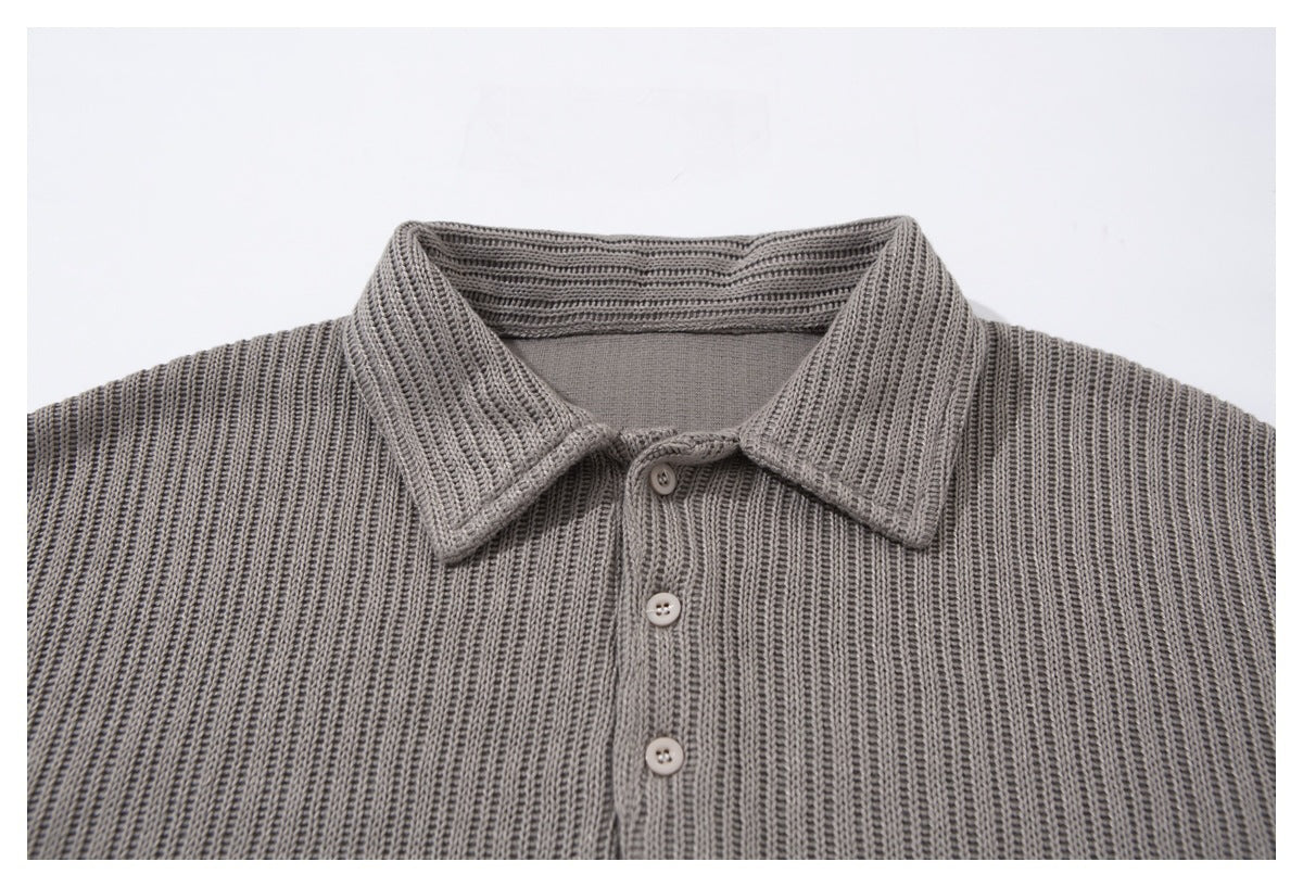 Close-up of the gray ribbed top’s pointed collar and three-button front placket.
