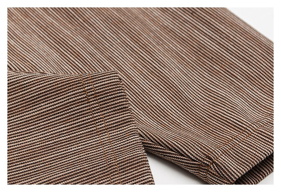 Close-up of a brown-and-cream fine-striped garment panel and ribbed cuff.