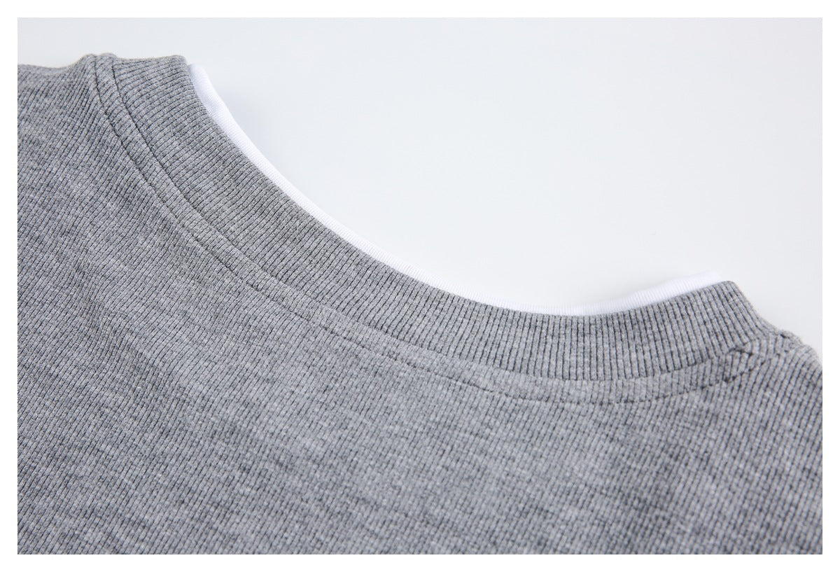 Close-up of a gray rib-knit neckline with white inner binding and visible stitching.