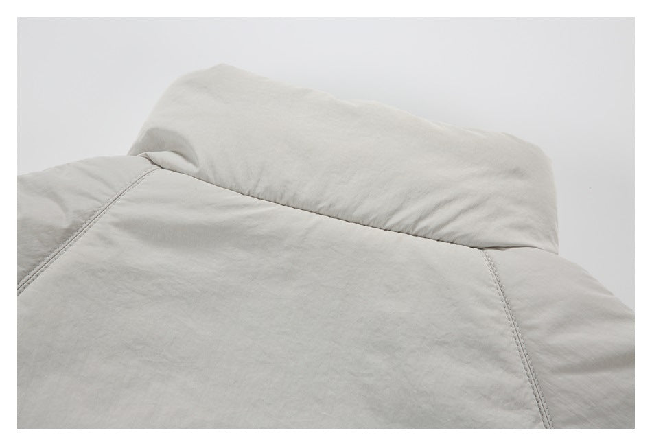 Close-up of the light gray jacket collar and shoulder seams.
