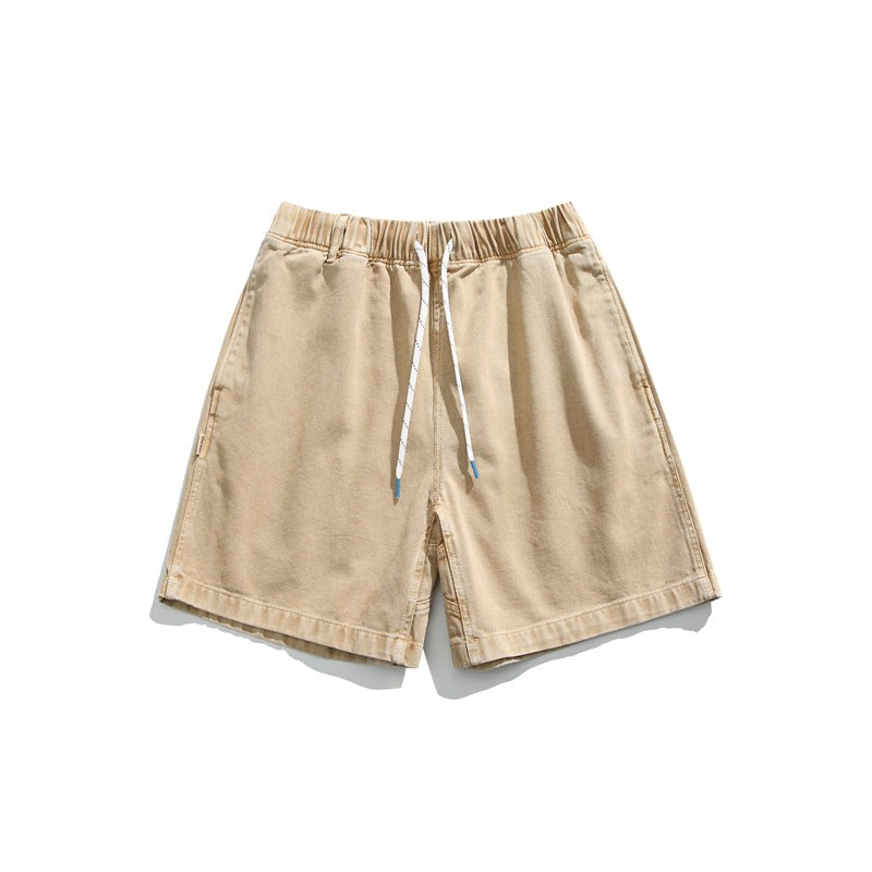 Dry leaf yellow washed shorts with elastic drawstring waist, flat lay front view