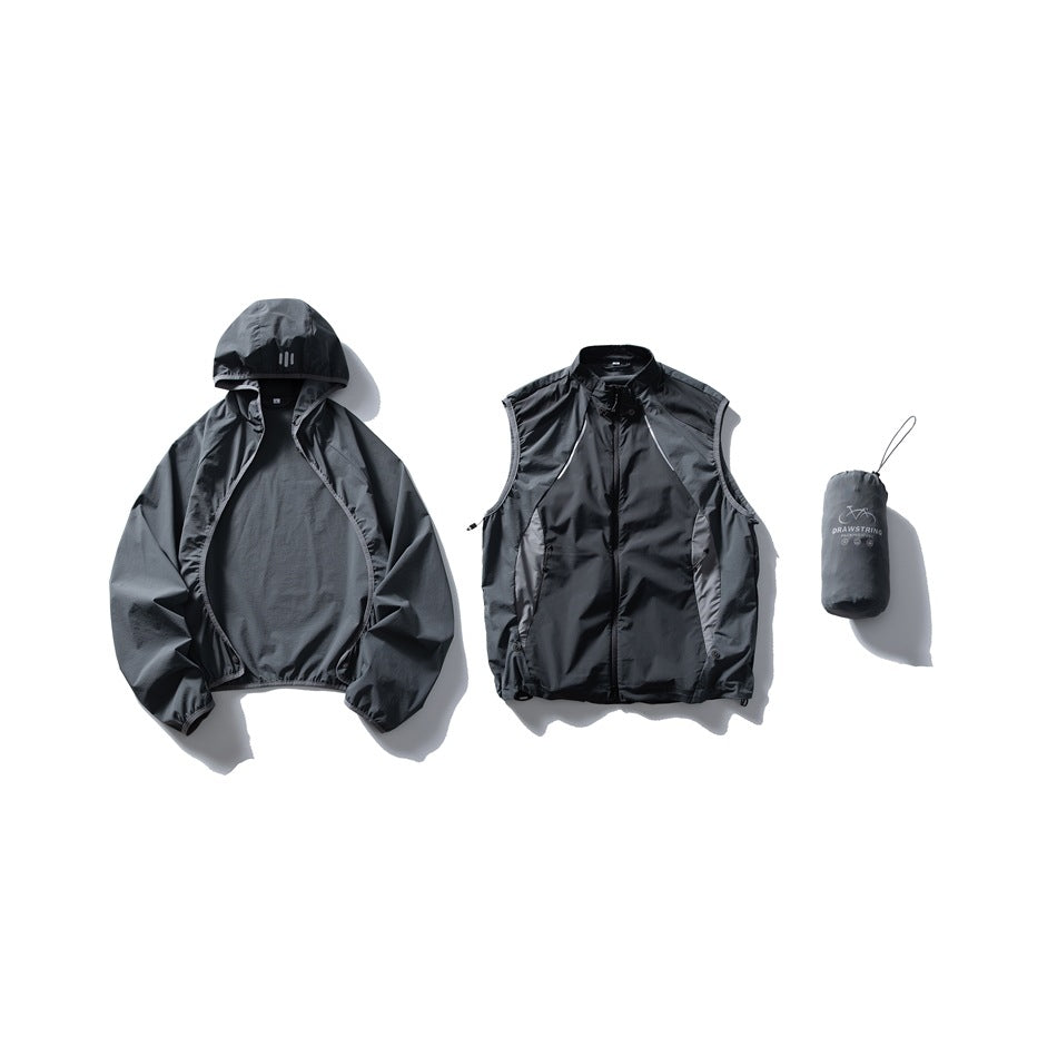 Charcoal hooded jacket, matching sleeveless zip vest, and drawstring pouch arranged together.