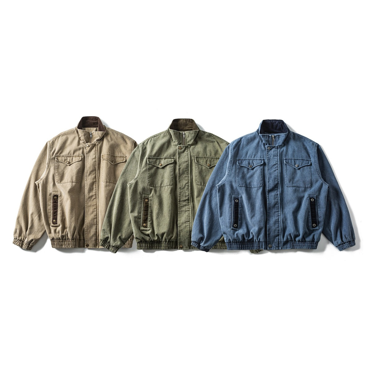 Three front-facing stand-collar jackets with chest pockets in tan, olive green, and blue.