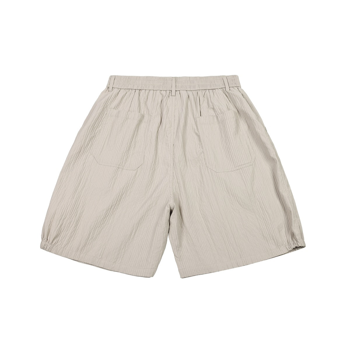 Back view of light beige shorts with a gathered waistband, belt loops, two patch pockets, and elasticized hems.