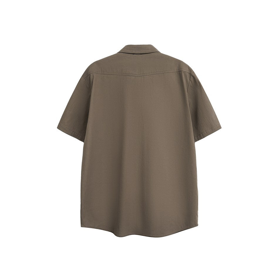 Back view of a brown short-sleeve shirt with a pointed yoke seam and curved hem on white background