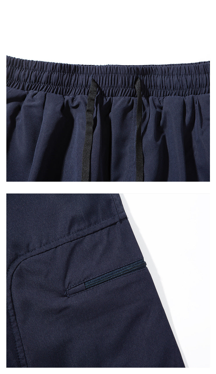 Close-ups of dark navy pants showing the elastic waistband, drawstrings, and a zippered pocket.
