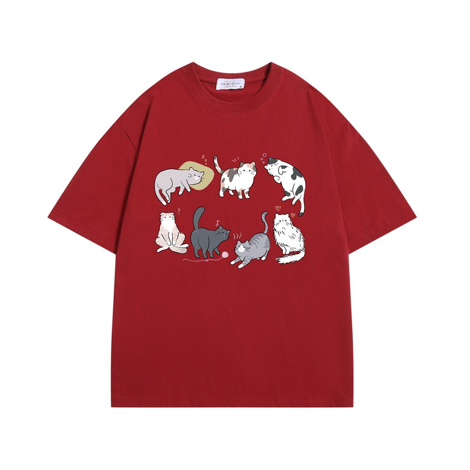 Red short-sleeve crew-neck T-shirt with a front graphic of seven illustrated cats in various poses