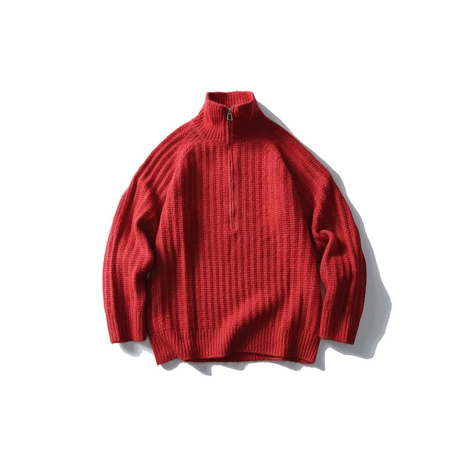 Red ribbed half-zip high-collar sweater laid flat, front view